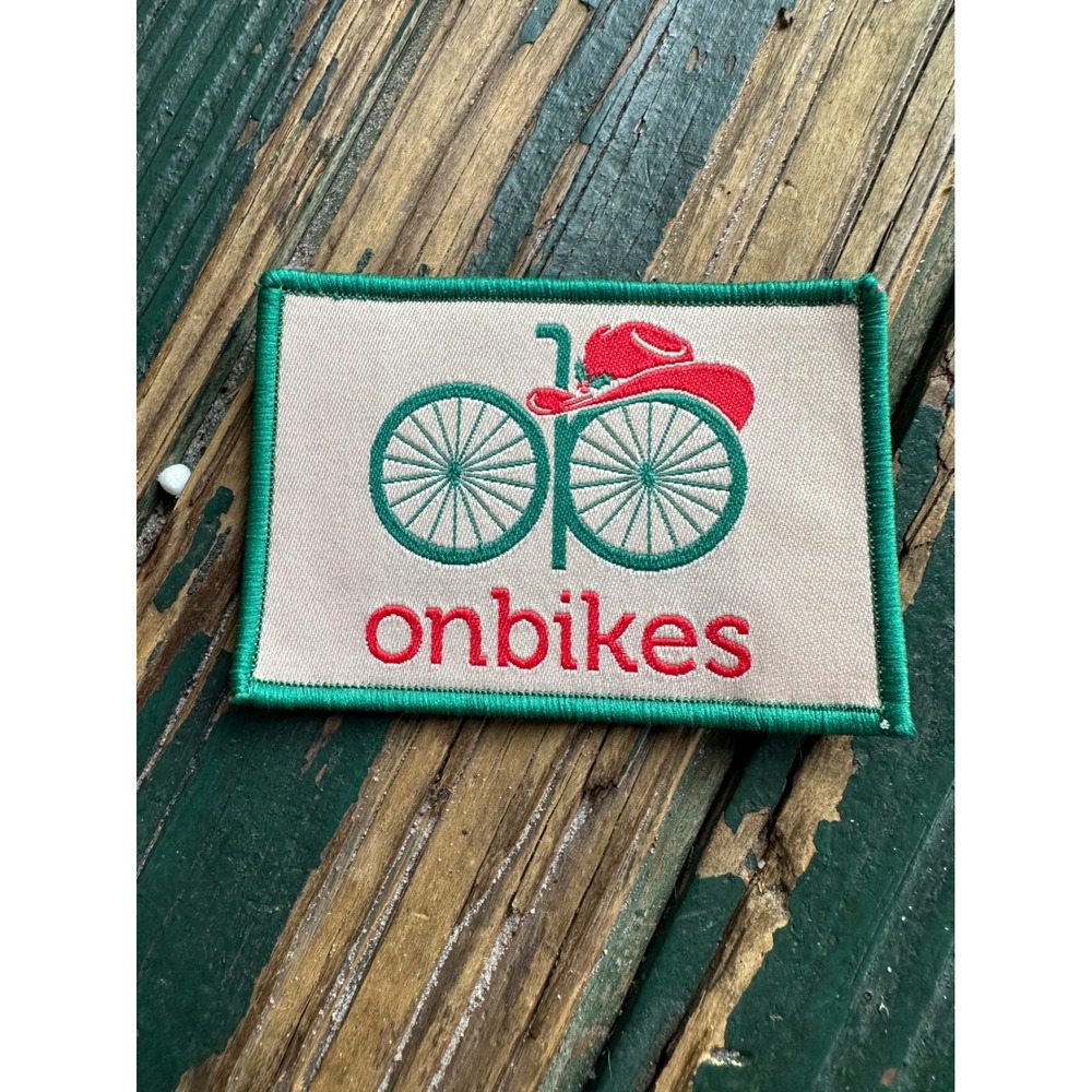 Onbikes Charity Bicycle Cowboy Hat Embroidered Patch Green Red Tan 3x2